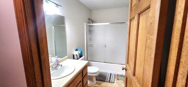 bedroom with baseboard heating, multiple windows, and wood-type flooring