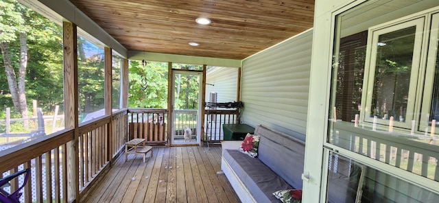 unfurnished sunroom featuring wooden ceiling