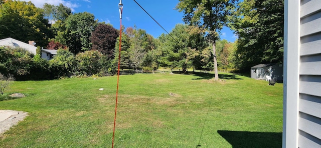 view of yard with a storage shed