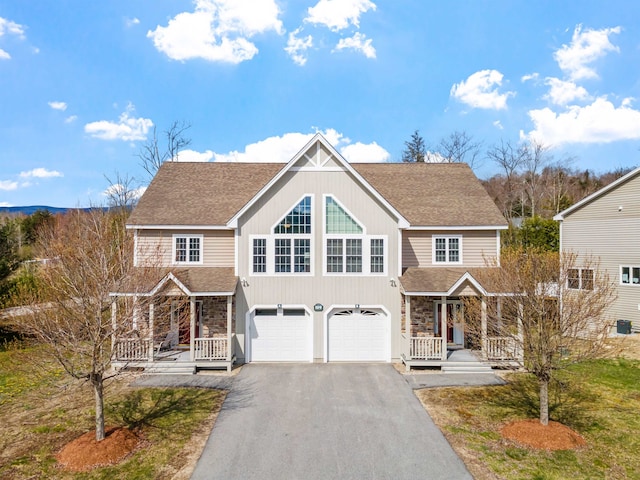 view of front of house featuring a porch and a garage