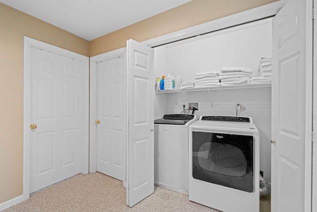 laundry room with washer and clothes dryer