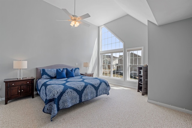 bedroom featuring ceiling fan, light colored carpet, and high vaulted ceiling