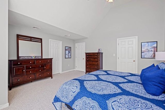 carpeted bedroom featuring lofted ceiling and ceiling fan