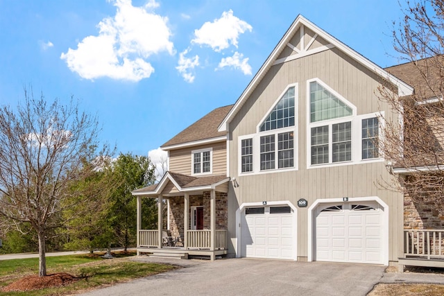 view of front of house with a garage and a porch