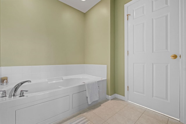 bathroom featuring tile patterned floors and a bathing tub