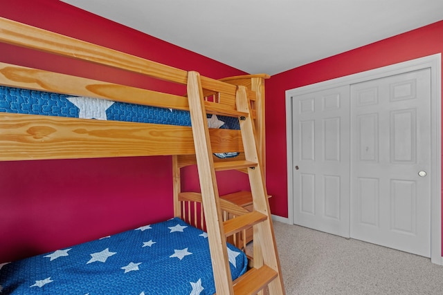 bedroom with carpet and a closet