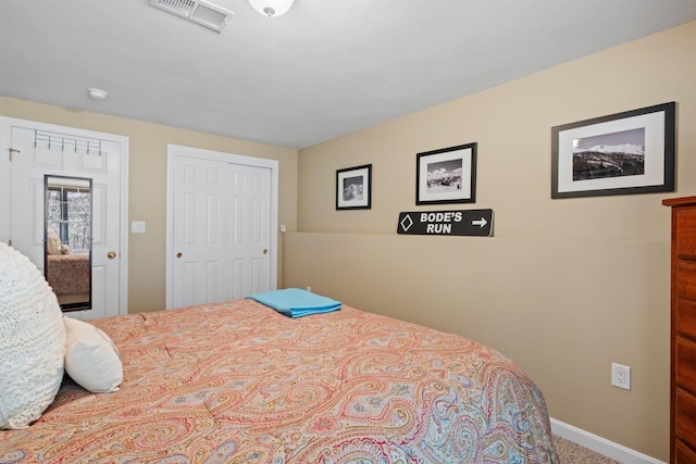 carpeted bedroom with a closet