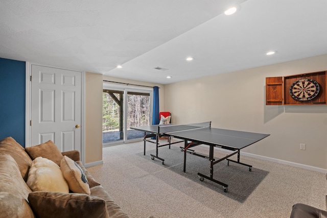 recreation room featuring light colored carpet