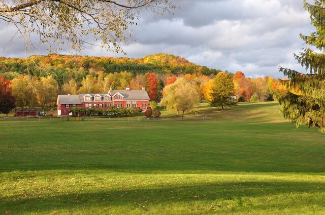 view of home's community featuring a lawn