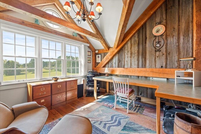 office area featuring vaulted ceiling with beams, hardwood / wood-style flooring, wooden walls, and a notable chandelier