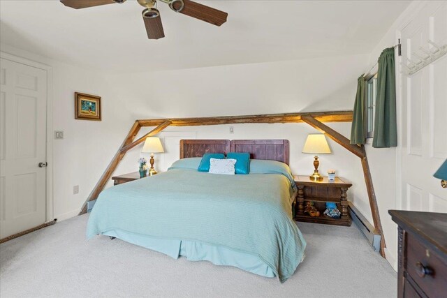 carpeted bedroom with ceiling fan and a baseboard radiator