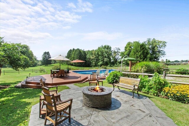 view of patio with a fire pit