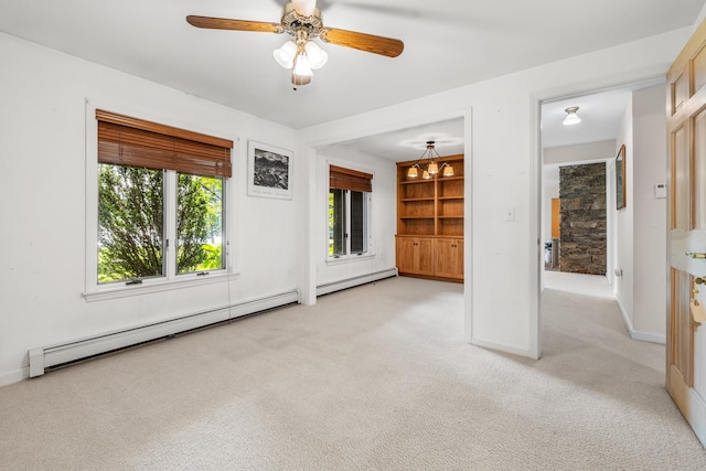 unfurnished living room with light carpet, baseboard heating, and ceiling fan