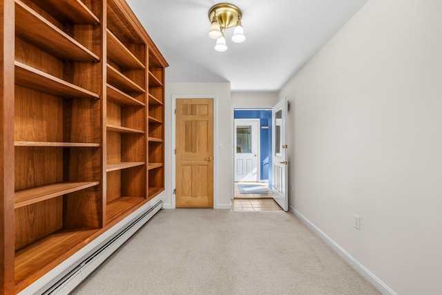 mudroom featuring light colored carpet and a baseboard radiator