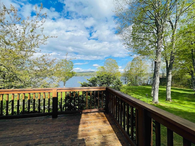 wooden deck featuring a water view