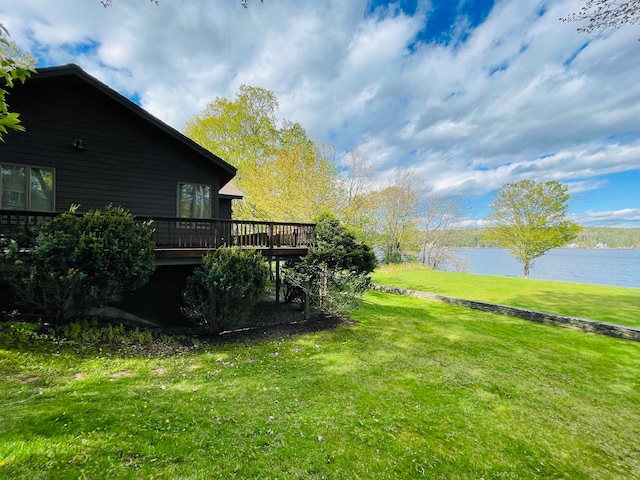 view of yard featuring a deck with water view