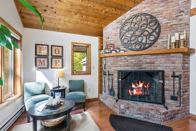 living area featuring a baseboard radiator, vaulted ceiling, wooden ceiling, a fireplace, and light wood-type flooring