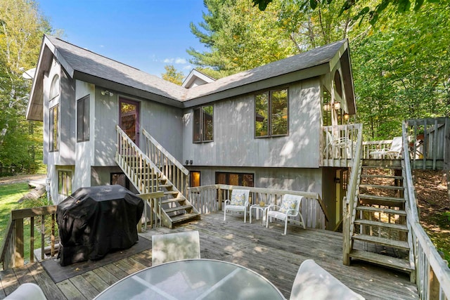 rear view of property with a wooden deck