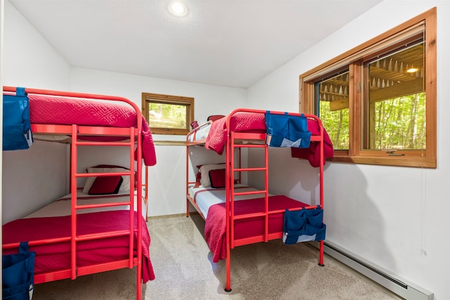 bedroom featuring carpet and a baseboard radiator