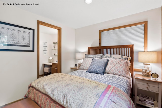 carpeted bedroom with ensuite bathroom