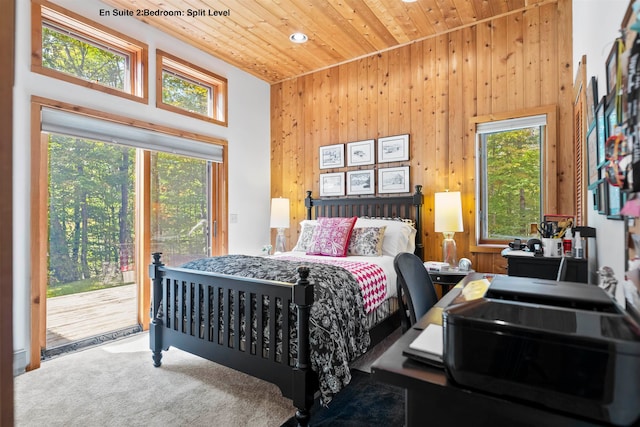 bedroom featuring a high ceiling, access to outside, wood ceiling, and carpet