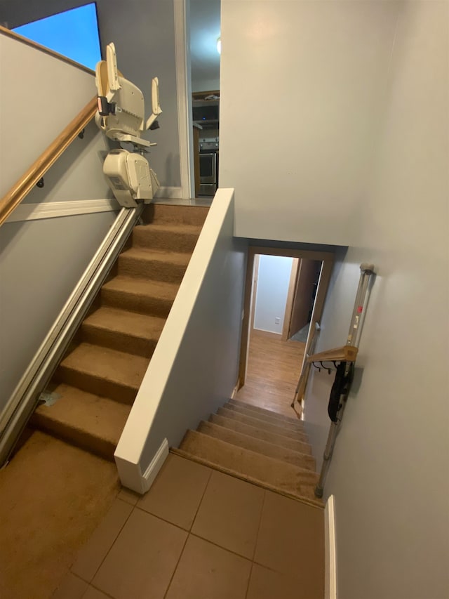 staircase with tile patterned flooring