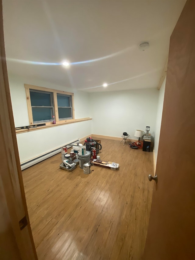 workout room with hardwood / wood-style flooring