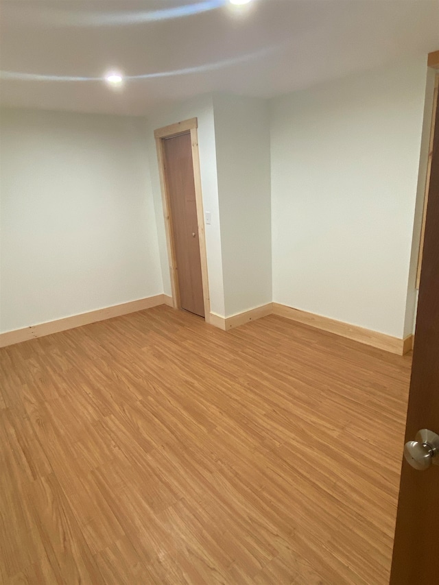 unfurnished room featuring light wood-type flooring