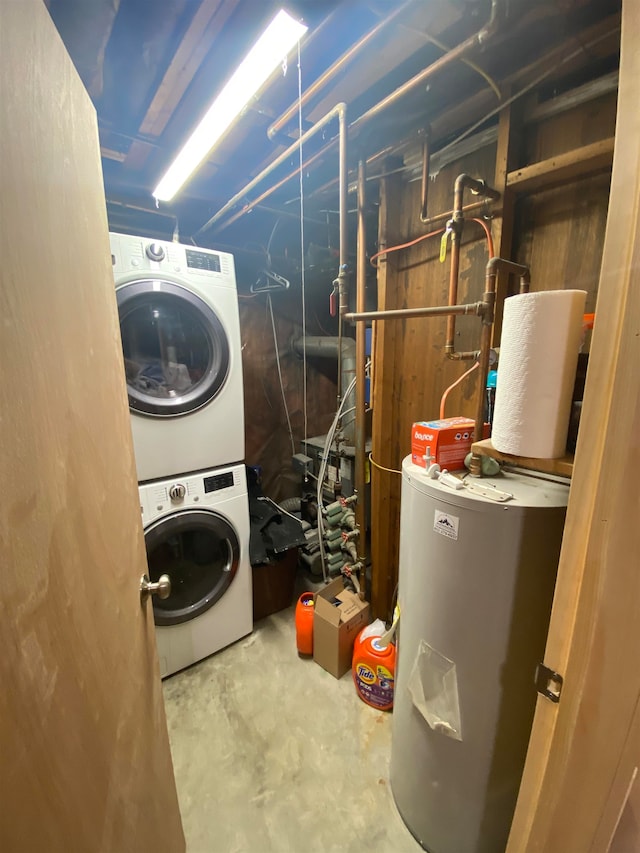 laundry area with stacked washer / dryer and electric water heater