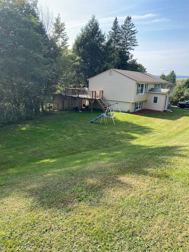 view of yard with a wooden deck