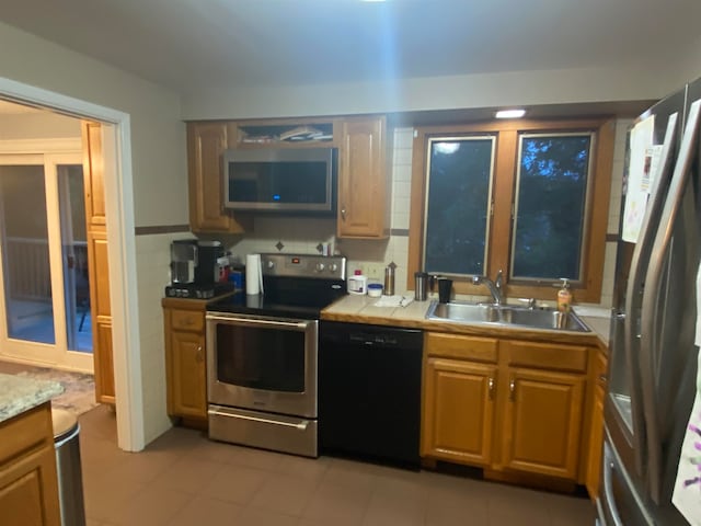 kitchen with appliances with stainless steel finishes and sink