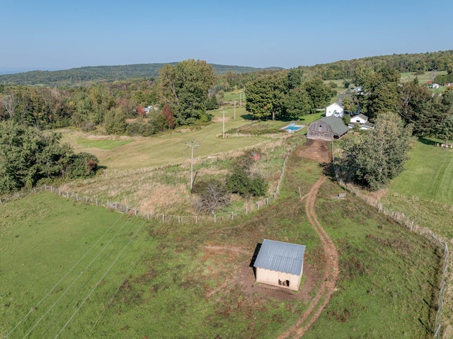 birds eye view of property with a rural view