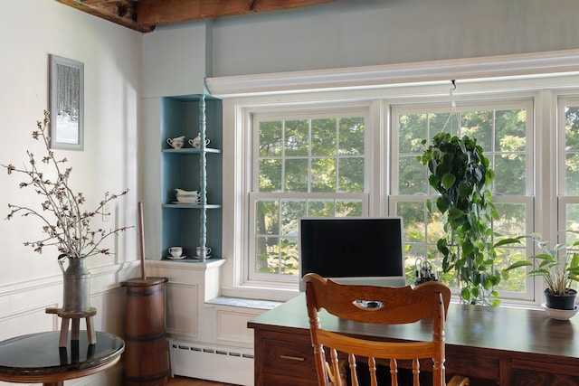 office with wood-type flooring and baseboard heating