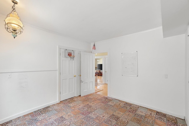 spare room with crown molding