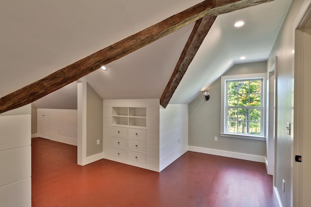 additional living space with lofted ceiling with beams