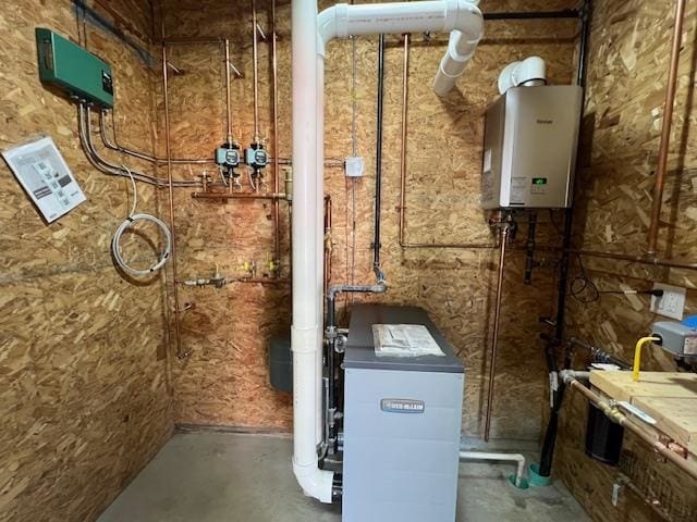 utility room with tankless water heater