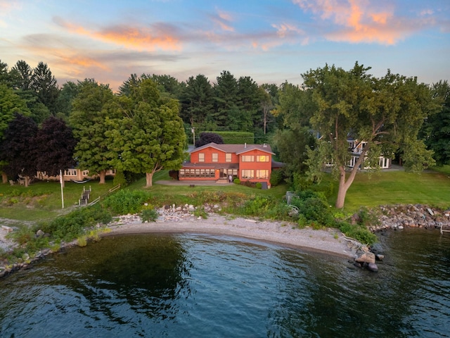 aerial view at dusk with a water view