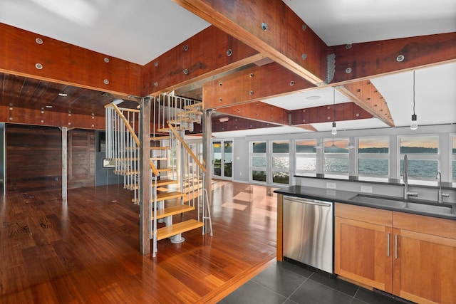 kitchen featuring a water view, dishwasher, sink, and dark hardwood / wood-style flooring