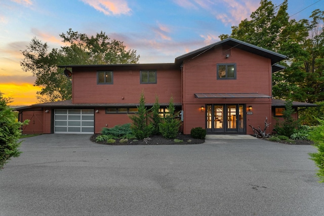 view of front of house featuring french doors and a garage