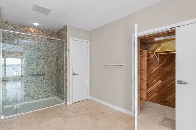 bathroom with wooden walls and a shower with door