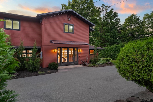 back house at dusk with french doors