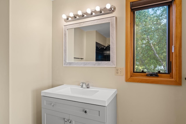 bathroom with vanity and plenty of natural light