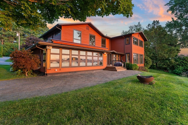 view of front of property with a yard