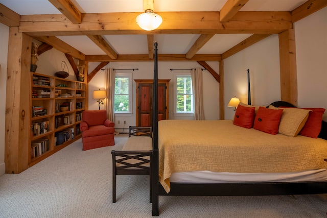 bedroom featuring beam ceiling and carpet floors