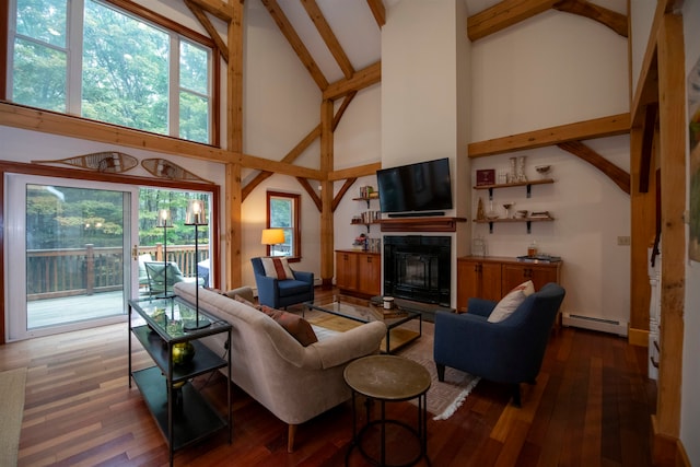 living room with beamed ceiling, hardwood / wood-style floors, a baseboard heating unit, and high vaulted ceiling