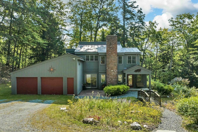 view of front of home with a porch and solar panels