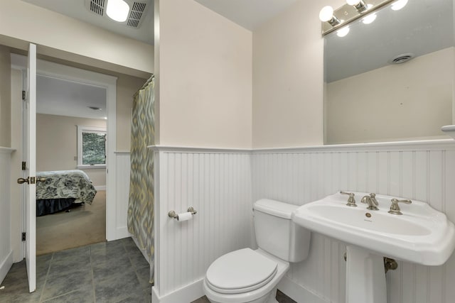 bathroom featuring sink and toilet