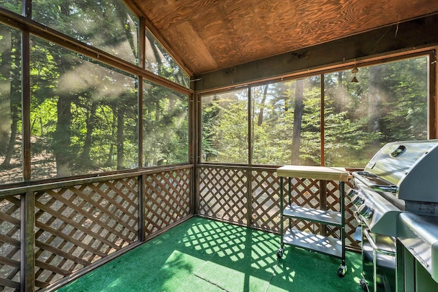 unfurnished sunroom with lofted ceiling and wooden ceiling