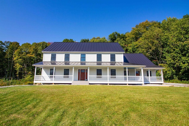 farmhouse inspired home with covered porch and a front yard