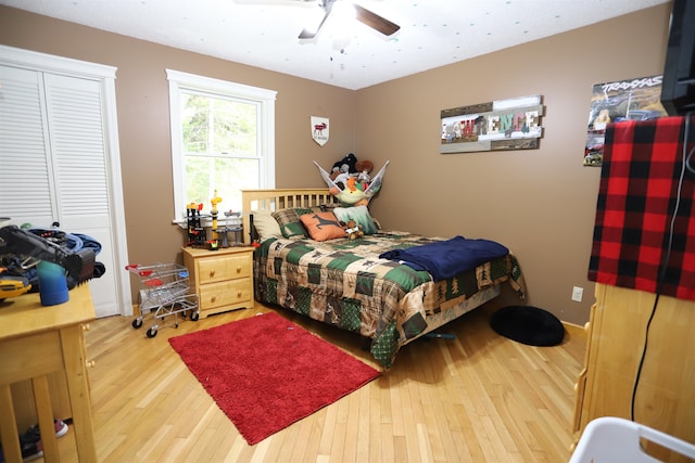 bedroom featuring wood-type flooring and ceiling fan